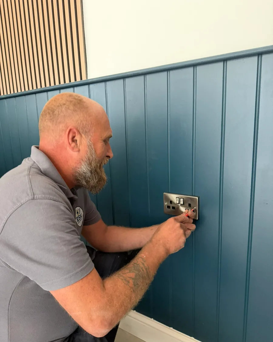Abbey Group electrician wiring a socket in a Whitby property